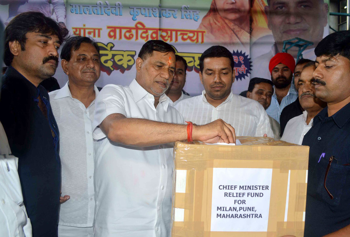 MLA & Ex.Mumbai Congresss President Kripashankar Singh Collecting Chief Minister Relief Fund in his Constituency to Help Victims Under Natural Calamity of Malin Village in Taluka Ambegaon Dist.Pune.