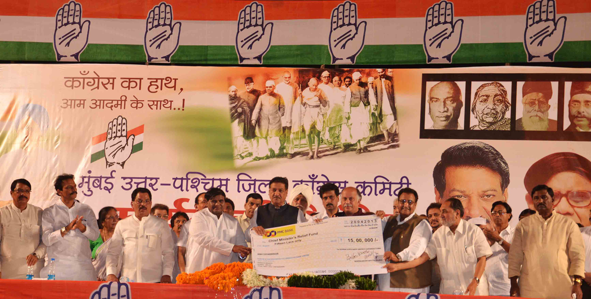 CHIEF MINISTER PRITHVIRAJ CHAVAN,MUMBAI CONGRESS PRESIDENT JANARDHAN CHANDURKAR ,MP & EX. UNION MINISTER GURUDAS KAMAT DURING MUMBAI NORTH WEST DISTRICT CONGRESS COMMITTEE CONGRESS WORKERS SAMMELAN AT ANDHERI SPORTS COMPLEX.