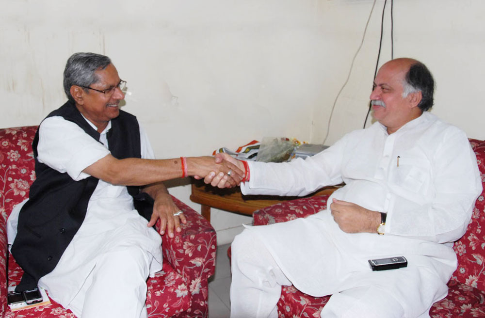 Union Minister Of State For Home, Telecommunications, Post And IT Gurudas Kamat Met Newly Appointed AICC. In Charge For Maharashtra Mohan Prakash At Congress HQ 24 Akbar Road in New Delhi