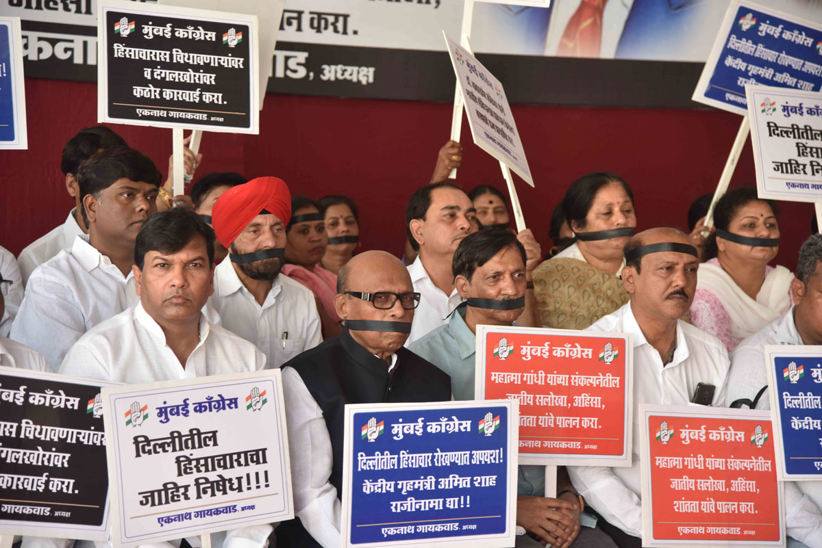 Mumbai Congress President with Team Silent Protest against Home Minister Amit Shah on violent incidents began at North East Delhi.