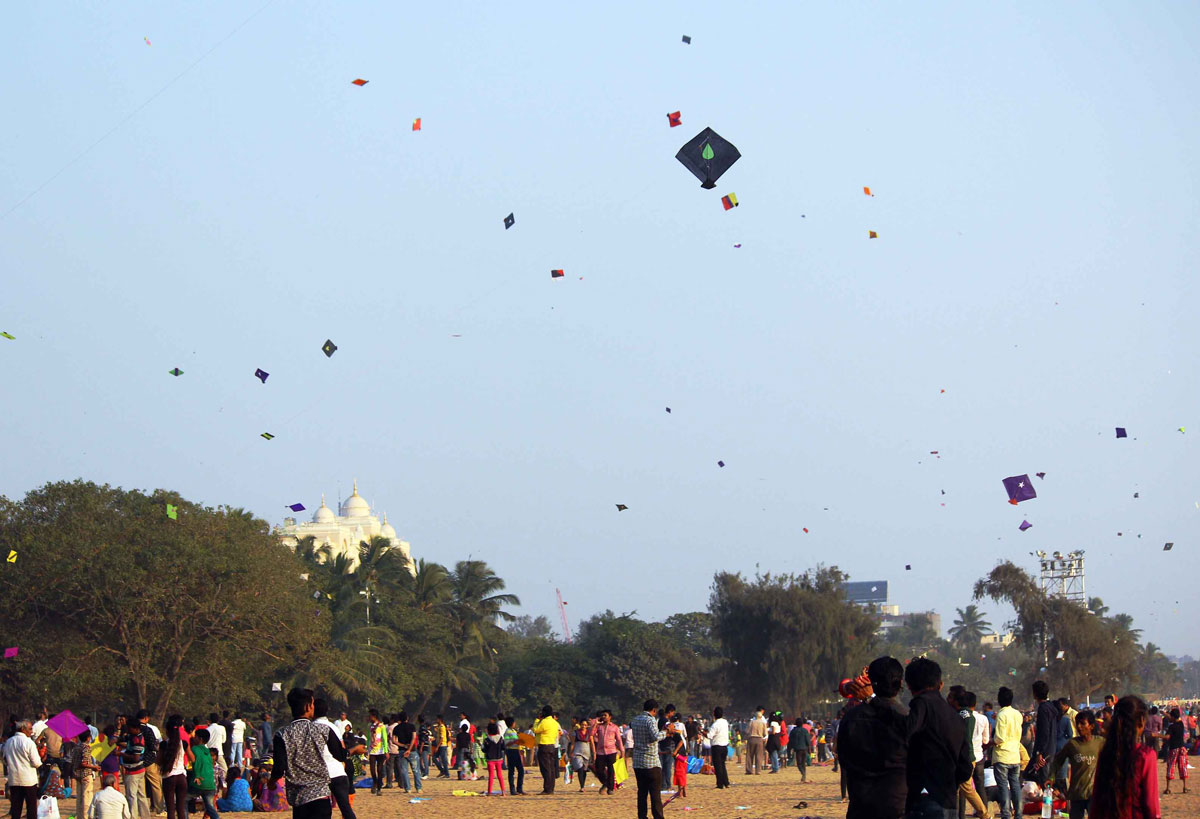 People Celebrating Makar Sankrant by Flying Kites At Girgoan Chowpatty.