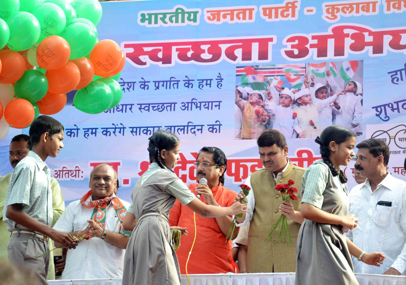 Chief Minister Devendra Fadnavis during "Swacchta Mission" at AP Market in Colaba Assembly.