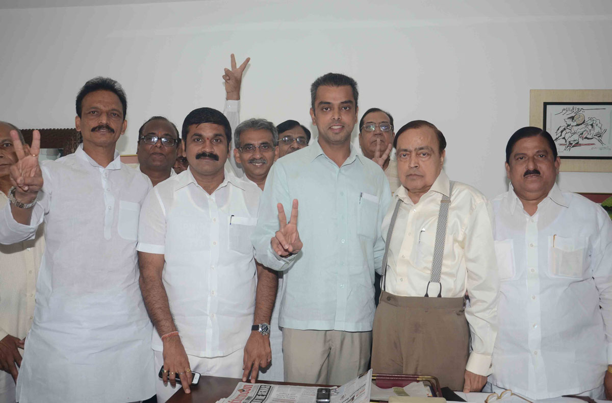 Congress/NCP/PRP (Kawade)/ Republican Party of India (Democratic) Alliance MP.Candidate Milind Deora with MP.Murli Deora before to File his Nomination Form.