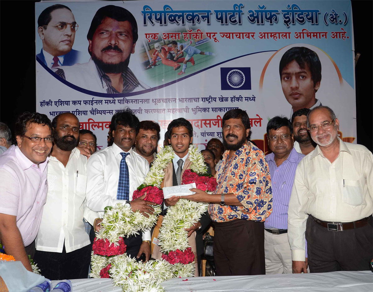 RPI PRESIDENT & EX.M.P. RAMDAS ATHAWALE HOCKEY PLAYER YURAJ VALMIKI & COACH DHANRAJ PILLE AT CHAITY BHOOMI DADAR.