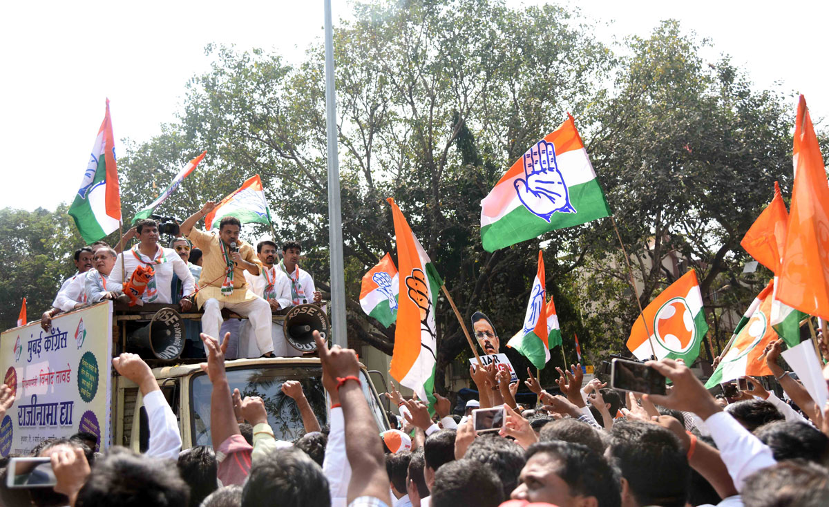 Mumbai Congress President Sanjay Nirupam with Party Workers Protest against BJP Minister Vinod Tawade at his Vile Parle Residence.