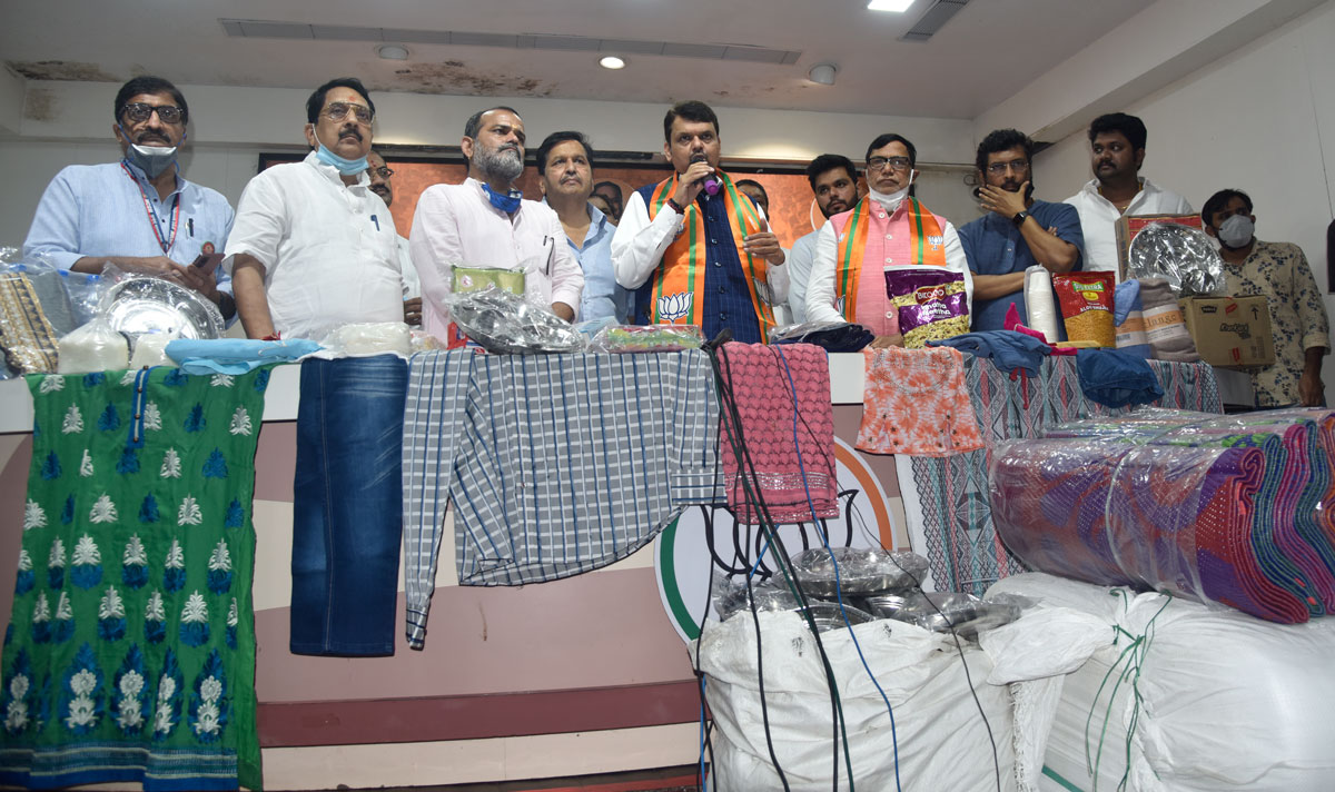 BJP Leader Kripashankar Singh arranged help by sending Flood Relief Fund Trucks which were Flag off by Opposition Party Leader Devendra Fadnavis near BJP Nariman Point Office.