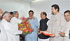 AICC MAHARASHTRA OBSERVER MOHAN PRAKASHJI CONGRATULATING CHIEF MINISTER PRITHVIRAJ CHAVAN ON HIS UNANIMOUS ELECTION TO THE COUNCIL AT VARSHA BUNGALOW.