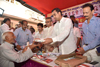 South Mumbai Congress Party Ex.Union Minister Milind Deora during Free Umbrella Distribution to Senior Citizens also Felicitation of SSC HSC Topper Students by Mobile Gifts at Tardeo.