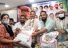 MRCC President Bhai Jagtap & MLA Zeeshan Siddique during Free Ration Kit Distribution. MRCC President Bhai Jagtap & MLA Zeeshan Siddique during Free Ration Kit Distribution.